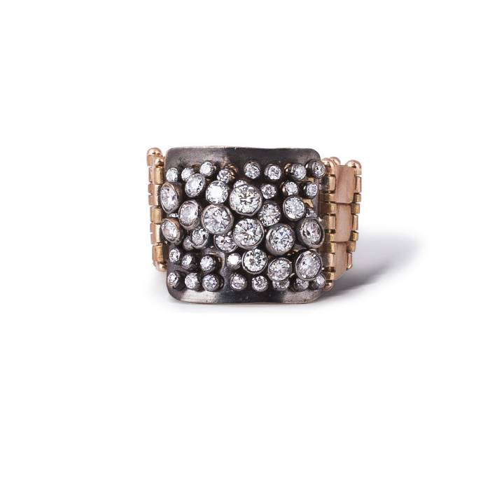 Diamond ring in 18k rose gold with fine make brilliant-cut diamonds and black platinum plated on top